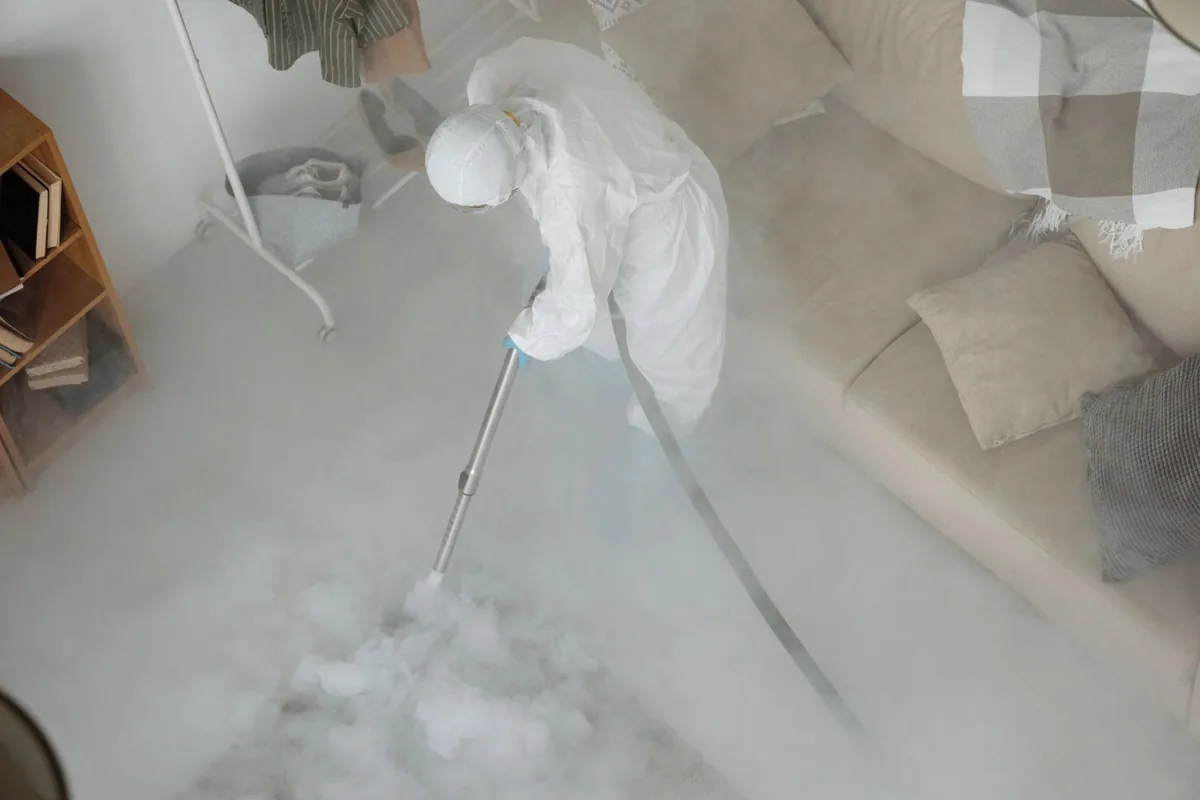 Biohazard cleanup technician in protective equipment, Shafer, MN